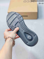Close-up of the textured outsole on a dark gray ECCO sneaker