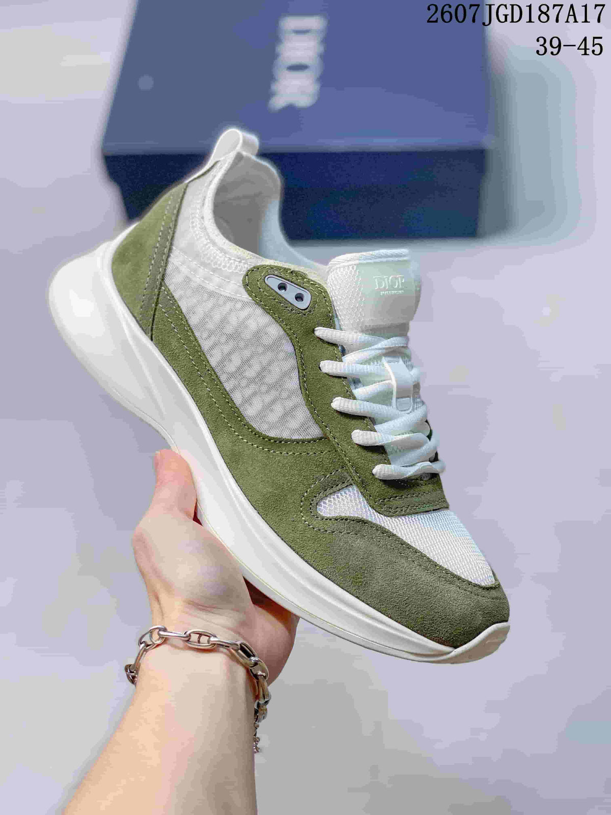 Olive green and white Dior B25 Runner sneaker with a patterned side panel and white outsole.