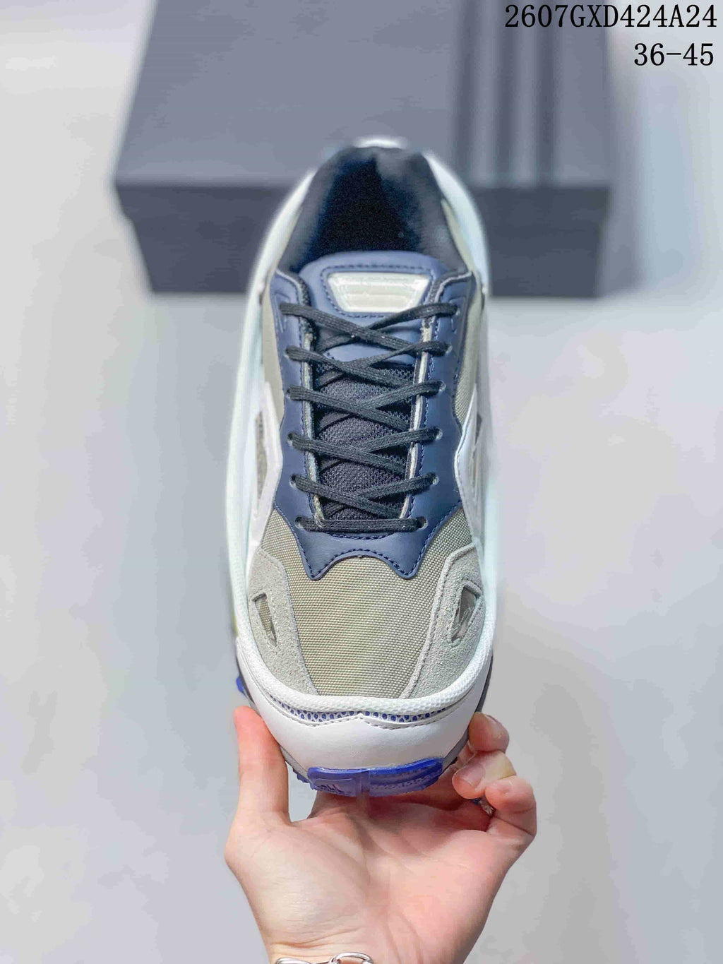 Top view showing the gray mesh toe area, navy lace panel, white overlays and black laces.