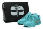 Aqua basketball shoes displayed in front of a black Sabrina-branded box.
