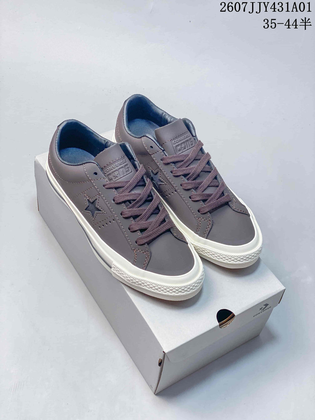 Pair of gray Converse One Star low-top sneakers with white soles