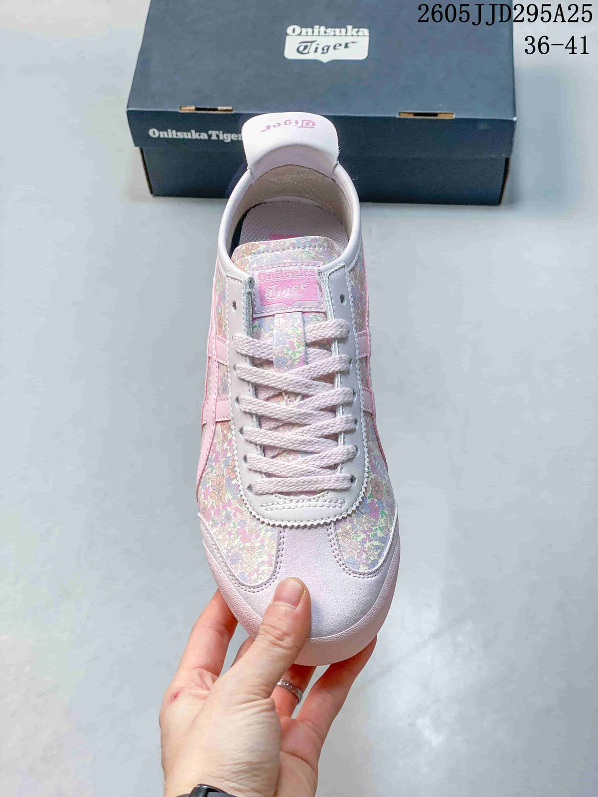 Top view showing the white laces, pink tongue label, and floral toe panels.