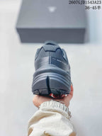 Rear view showing the padded heel collar, layered heel structure, and outsole tread.