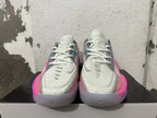 Front view showing the laces and toe details of pink and grey Nike GT Cut 3 shoes