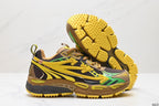 Side and outsole view highlighting the multicolor layered upper, mesh panels, chunky midsole, and textured yellow tread.