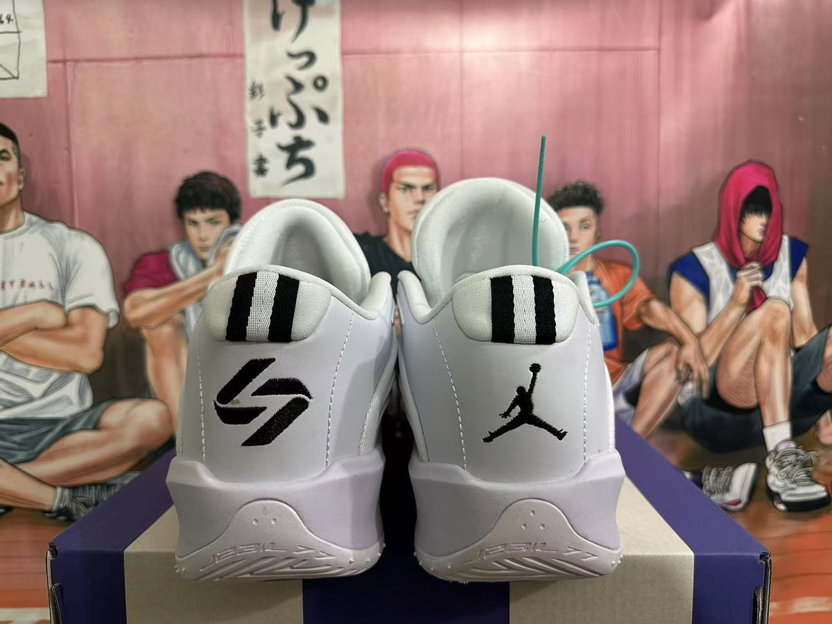 Rear view of white Jordan sneakers with black heel logos and striped heel tabs