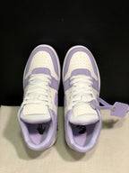 Top view showing perforated toe boxes, flat laces, padded tongues, and attached lace tags.