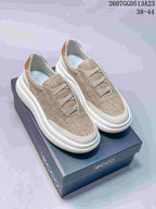 Beige ECCO casual slip-on sneakers displayed on a branded shoebox, with style code 2607GGD513A23 and size range 38-44 visible.