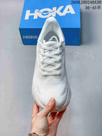 Front view of the white running shoe with laces